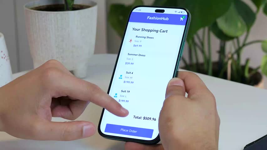 A man's hands finalize a secure online payment on a mobile shopping app, culminating in a successful purchase confirmation. This clip is essential for app usability videos, and content about consumer