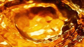 Super Slow Motion Detail Shot of Waving Golden Liquid at 1000fps. - Powered by Shutterstock - Get 15% off with code: PIKWIZARD15