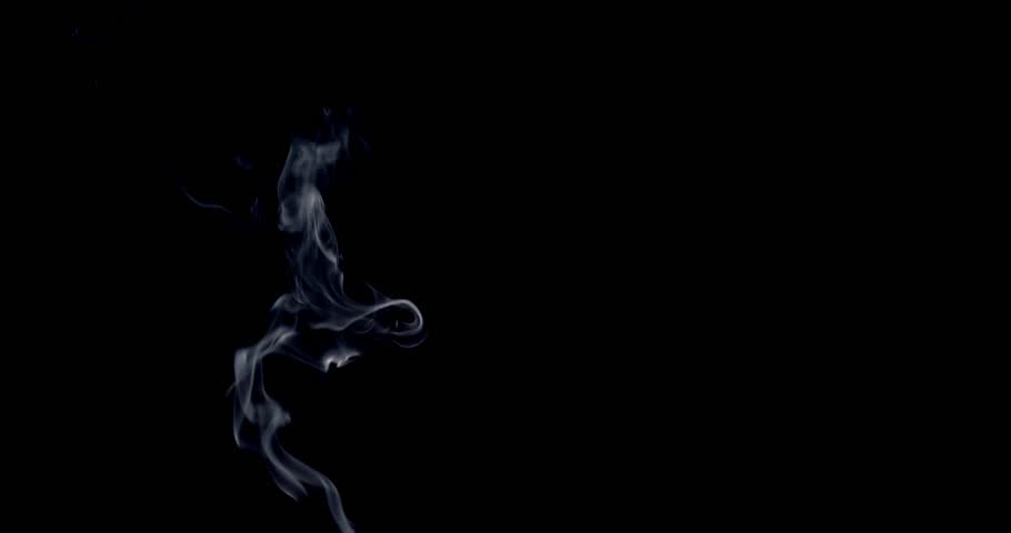 Real smoke on a black background. Thin Flexible Trickle of Real Smoke. Colorful real smoke rises up. Ideal for background or over-layer with blending mode add, screen, lighten.