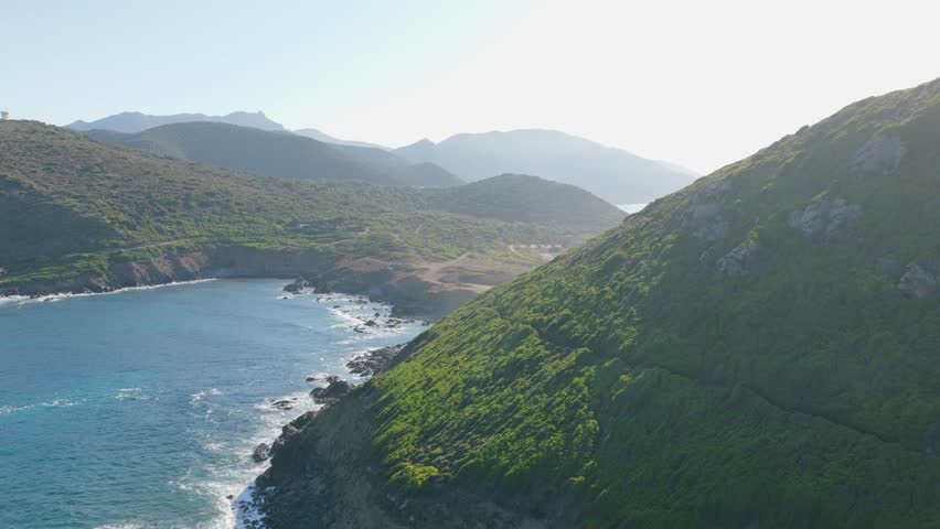 Spectacular 4K Aerial View of Corsica’s Wild Coastline with Turquoise Sea and Mountains
