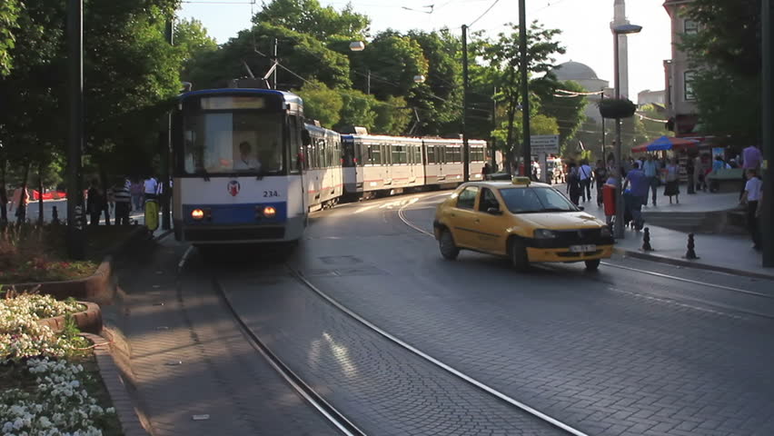 ISTANBUL - JUNE 6: Tram passes on crossroad at Sultanahmet Square on June 6,