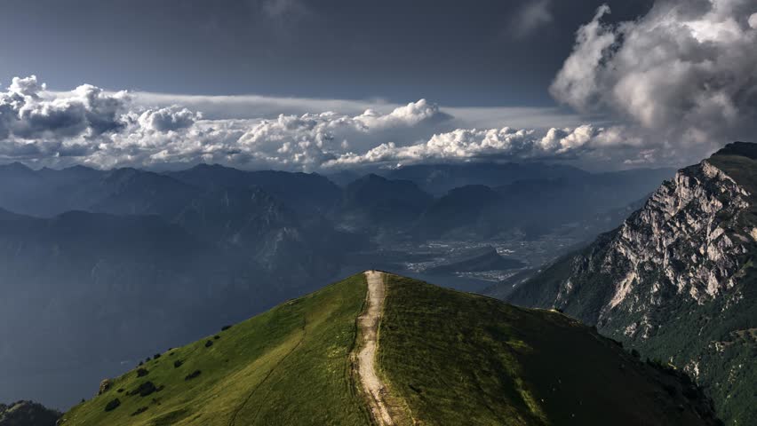Cinematic hyperlapse over Monte Baldo trail with dramatic clouds