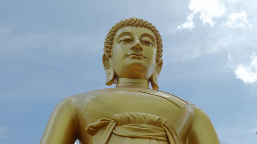 Footage of the majestic Big Buddha golden statue inside Wat Paknam Phasi Charoen Temple in Bangkok, Thailand. The video captures the intricate details of the statue and the sacred interior.