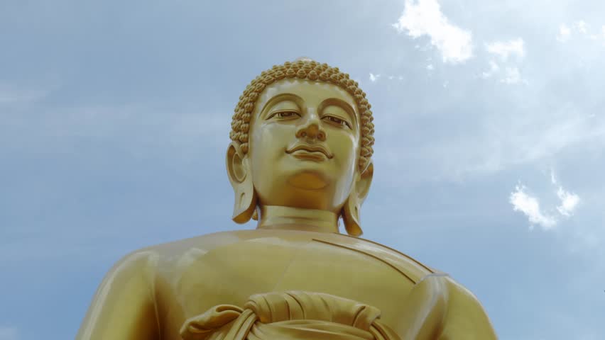 Footage of the majestic Big Buddha golden statue inside Wat Paknam Phasi Charoen Temple in Bangkok, Thailand. The video captures the intricate details of the statue and the sacred interior.