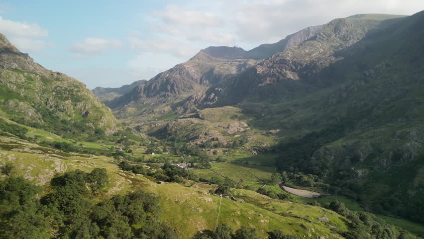 Stunning Pen-y-Pass - aerial drone flyover, Crib Goch background on a sunny summer afternoon - North Wales, UK