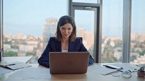 Successful lady looking laptop sitting contemporary office desk closeup. Smiling businesswoman typing computer writing business email. Elegant woman executive creating online project at workspace. - Powered by Shutterstock - Get 15% off with code: PIKWIZARD15