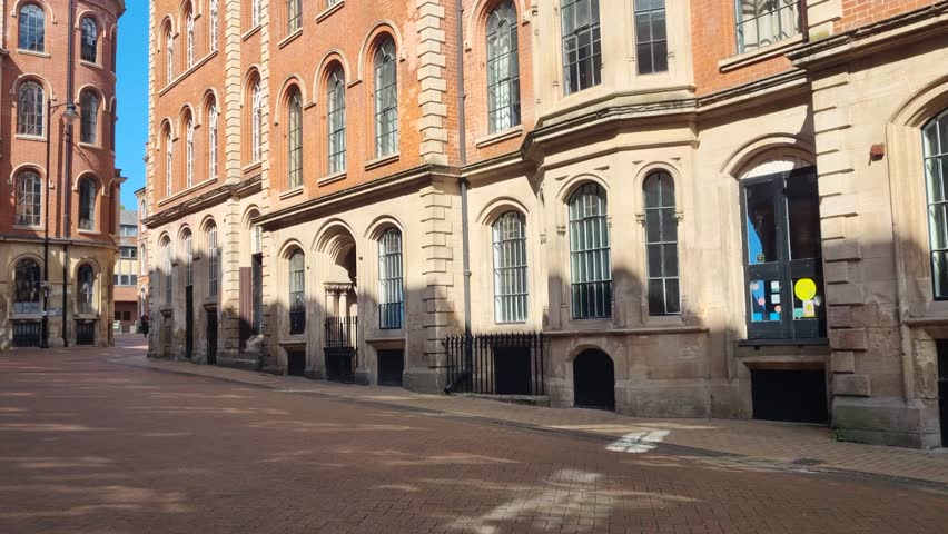 Scenic view of historic Broadway at Nottingham’s Lace Market, showcasing elegant architecture and heritage charm under a clear blue sky