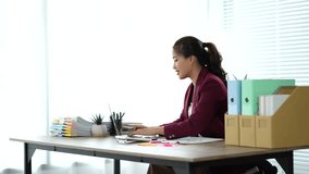 Young Asian woman doing financial accounting and taxes for a company Organizing account analysis reports Investment information Financial and tax system concepts - Powered by Shutterstock - Get 15% off with code: PIKWIZARD15