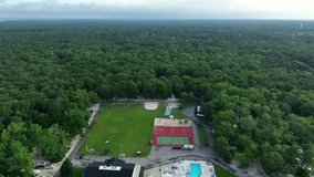 Stone Barbie campground surrounded by green nature of New Jersey. Aerial top down showing swimming pool, grass field, tennis court and basketball field. Holiday in usa. - Powered by Shutterstock - Get 15% off with code: PIKWIZARD15
