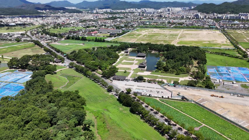 Aerial drone view of Donggung Palace and Wolji Pond at night in Gyeongju, South Korea