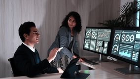 Male business colleagues and female marketing staff talking, consulting, looking at graphs, analyzing, planning work together, monitoring stock trading in the market, company desk. - Powered by Shutterstock - Get 15% off with code: PIKWIZARD15