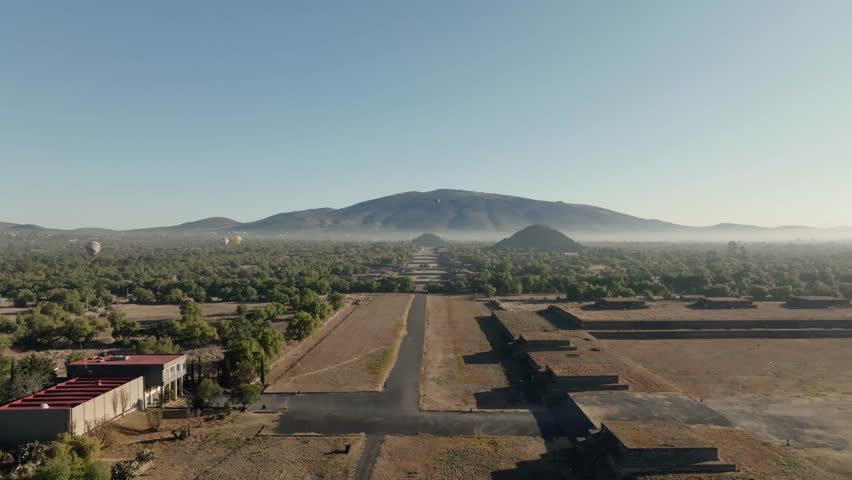 Cinematic Shot Of Teotihuacan City of Gods, Aztec Pyramids, Hot Air Balloons Flying Peacefully, Mexico