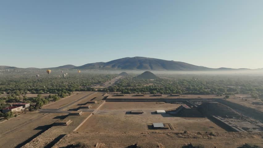 Aerial Shot Of Teotihuacan City of Gods, Aztec Pyramids, Hot Air Balloons In Background, Mexico