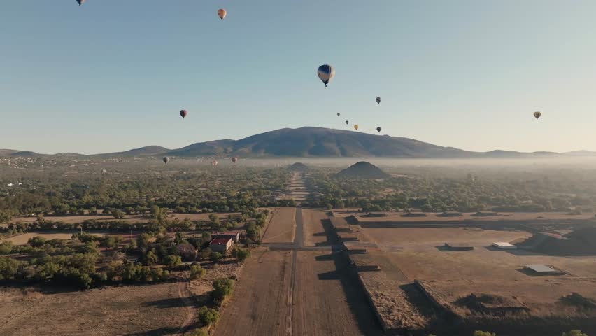 Cinematic Shot Of Teotihuacan City of Gods, Aztec Pyramids, Hot Air Balloons Filling Blue Sky, Mexico