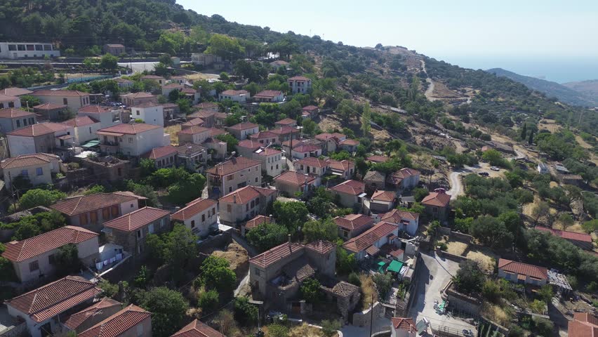 Skalochori, Island Lesvos, Greece - July 16th, 2025 - footage of the village, school, mountains, fields, traditional and historical architecture, church, slopes and nature around