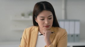 businesswoman at organized desk writing down goals and ideas for company improvement strategy - Powered by Shutterstock - Get 15% off with code: PIKWIZARD15