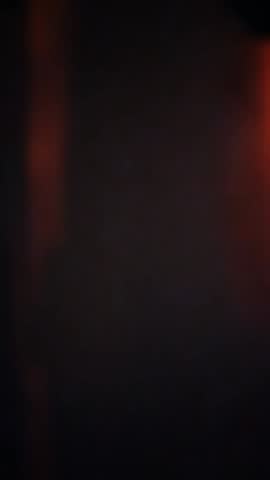 Sunset blurred light leaks reflected on the wall motion video background. Abstract red colored aesthetic vertical video