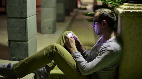 Young man using smartphone in the city
