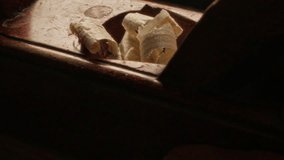 Close up view of unrecognizable craftsman using hand planer to polish surface of timber piece, producing curled wood shavings - Powered by Shutterstock - Get 15% off with code: PIKWIZARD15