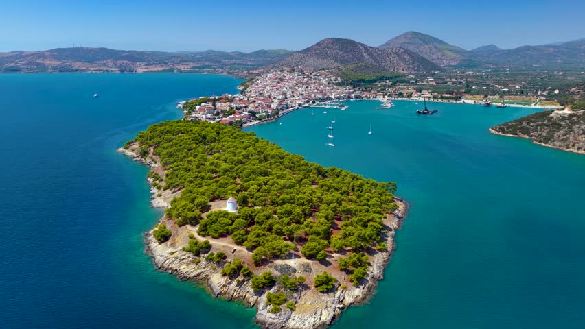 Panoramic aerial view of the town and marina of Ermioni, Peloponese, Greece, with the old lighthouse in front