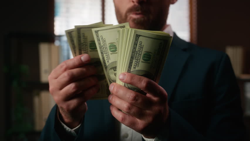 Close up male hands holding dollars excited Caucasian office businessman say wow counting cash cropped view closeup business man hold money financial success celebrate investment income achievement