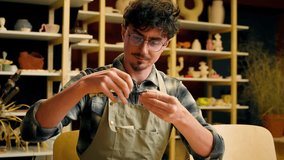 Male sculptor craftsman potter man Caucasian guy in pottery workshop art designer architect artisan holding measuring tool instrument ceramics design craft handmade drawing measure equipment working - Powered by Shutterstock - Get 15% off with code: PIKWIZARD15
