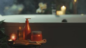 A bathroom features a blurred freestanding white bathtub. In the foreground, table displays luxurious bath products, including lotion bottle, jar, and candle, creating a calming, spa-like ambiance. - Powered by Shutterstock - Get 15% off with code: PIKWIZARD15