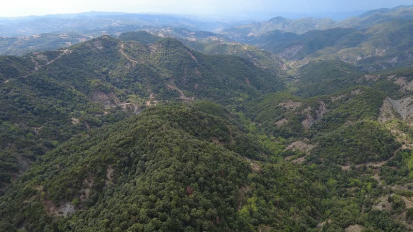 Cinematic Drone Flight Over Dense Forested Mountains in Arta Greece - 4K