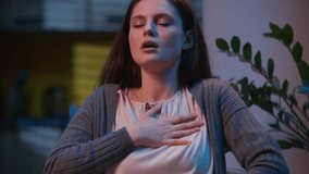 Stressed woman heart attack pain in chest sick Caucasian girl at night home evening health problem ache emergency medicine help heartache hurt in breast symptom pressure cardio unwell female scared - Powered by Shutterstock - Get 15% off with code: PIKWIZARD15
