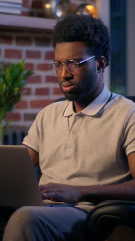 Thoughtful businessman African American guy thinking business man searching idea in evening office consider decision male trader employee think project plan online late working laptop in dark night