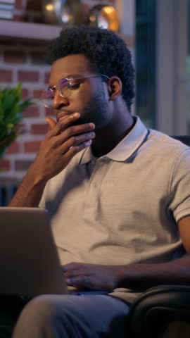 Thoughtful businessman African American guy thinking business man searching idea in evening office consider decision male trader employee think project plan online late working laptop in dark night