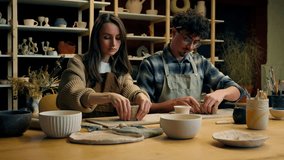 Caucasian woman man girl guy couple date in pottery workshop teacher potter sculptor artist student modeling clay handmade ceramics art studio hobby craft happy smile thumb up together like recommend - Powered by Shutterstock - Get 15% off with code: PIKWIZARD15