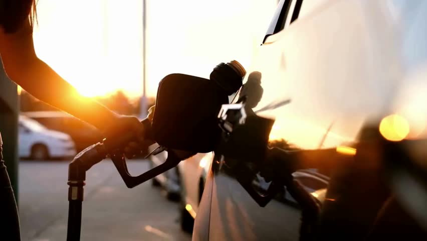 service staff Handle pumping gasoline fuel nozzle to refuel. Vehicle fueling facility at petrol station Refueling car at gas station pump concept.