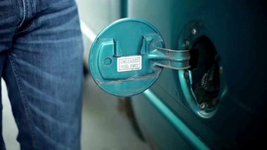 Filling car with gas fuel at station pump. Car filling up with fuel. Diesel Oil. Gas nozzle in car's fuel tank. Fuel, gas station, petrol prices