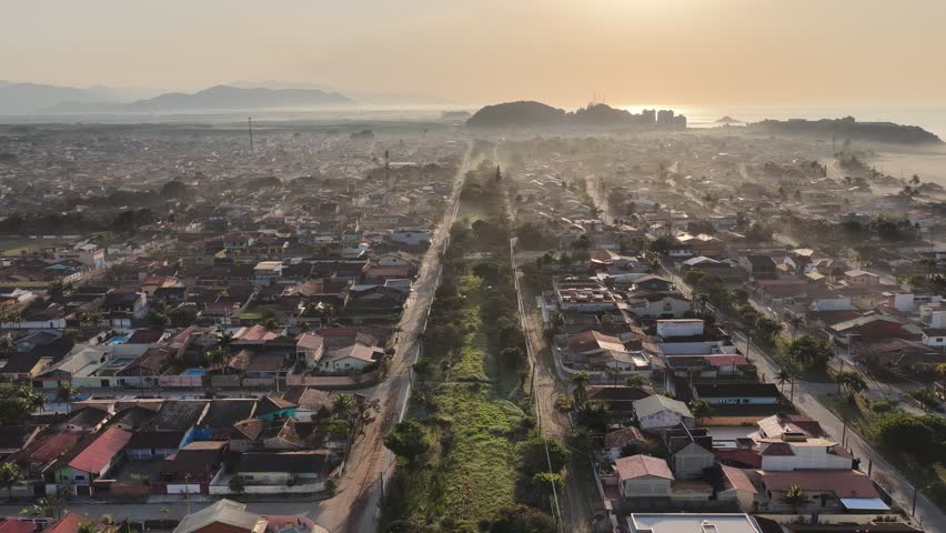 Sunrise City In Itanhaem Sao Paulo Brazil. Aerial View Of Stunning Beach With Crystal Clear Waters. Sunset Sky Downtown. Sunset Outdoors Downtown Panoramic City. Itanhaem Sao Paulo.