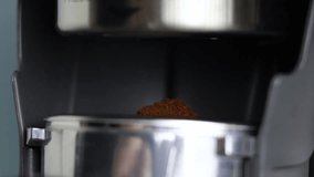 Freshly ground coffee in an espresso portafilter. Espresso machine, coffee shop atmosphere, cozy ambiance, high-quality coffee, crema, and a flavorful, velvety, and full-bodied espresso. Barista - Powered by Shutterstock - Get 15% off with code: PIKWIZARD15