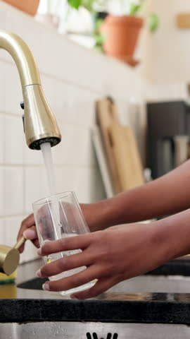 Home, hands and woman with tap water in glass for hydration, thirst and natural nutrients. Kitchen, person and pour liquid at faucet for refreshing drink, fresh beverage and body detox for wellness