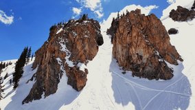 Spring cornice rock walls chute Deer Creek Trail Montezuma winter Rocky Mountain Colorado avalanche terrain aerial drone sunny blue sky deep powder snow snowmobile ski snowboard backcountry forward up - Powered by Shutterstock - Get 15% off with code: PIKWIZARD15