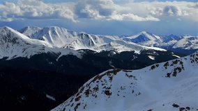 Rocky Mountains Quandary peak Montezuma Deer Creek aerial drone Colorado Breckenridge Bald Mountain Boreas Pass summit county snow covered winter spring afternoon backcountry blue sky clouds pan left - Powered by Shutterstock - Get 15% off with code: PIKWIZARD15