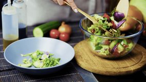 Mixing Fresh Salad In Bowl. Home Cooking. Delicious And Nutritious Meal, Vegetarian Cuisine, Chef Tossing Vegetables. Organic Ingredients Homemade Salad. Dinner Preparation Clean Eating. Green Lettuce - Powered by Shutterstock - Get 15% off with code: PIKWIZARD15