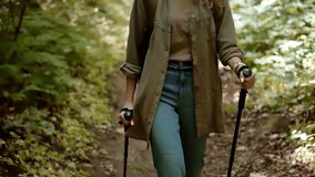 Hiker Nordic Walking With Trekking Poles, Young Woman Hiking In Lush Forest, Outdoor Recreation And Exercise, Active Lifestyle, Physical Wellness Journey. Hiking Activity Trail Walking Fitness Hobby - Powered by Shutterstock - Get 15% off with code: PIKWIZARD15