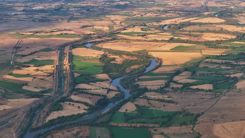 Euphrates River and sunset in the middle of agricultural land