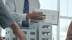 Real estate market analysis presentation urban office setting business meeting professional environment close-up view data insights - Powered by Shutterstock - Get 15% off with code: PIKWIZARD15