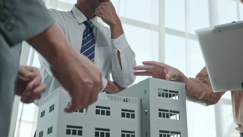 Real estate market analysis presentation urban office setting business meeting professional environment close-up view data insights