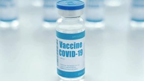 Focus on a COVID-19 vaccine vial in a sterile environment, showcasing the innovation in medicine and technology crucial for public health. The emphasis is on manufacturing processes. - Powered by Shutterstock - Get 15% off with code: PIKWIZARD15