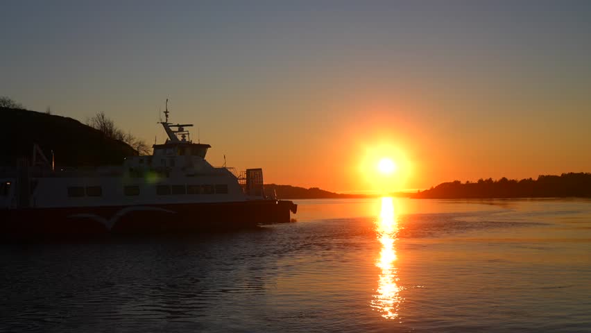 Hovedøya Sandefjord Strömstad Oslofjord costal seaside town sailboat ferry boat ride winter Artic Circle golden hour sunset sunrise sun flare on horizon reflection Norway Sweden coastline islands