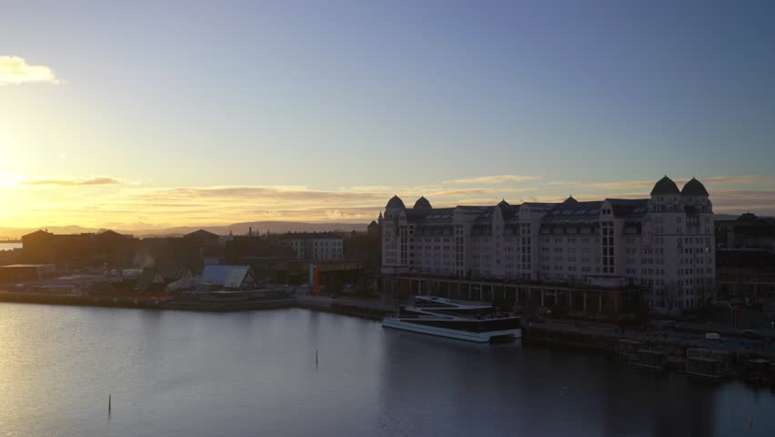 Norwegian sauna spa OsloFjord winter afternoon sunset day Oslo Norway Norge Oslo Opera House sea marina birds seagulls buildings clouds clear blue skies arctic sea buildings cruise ship yacht pan left