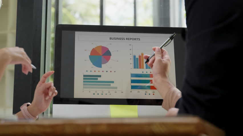 Close up of hand teamwork business group are meeting working overtime and brainstorming about business financial and marketing on paperwork and presentation. - Powered by Shutterstock - Get 15% off with code: PIKWIZARD15