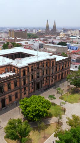 Vertical aerial orbit overlooking the facade of the Ministry of Culture building Guadalajara, Mexico