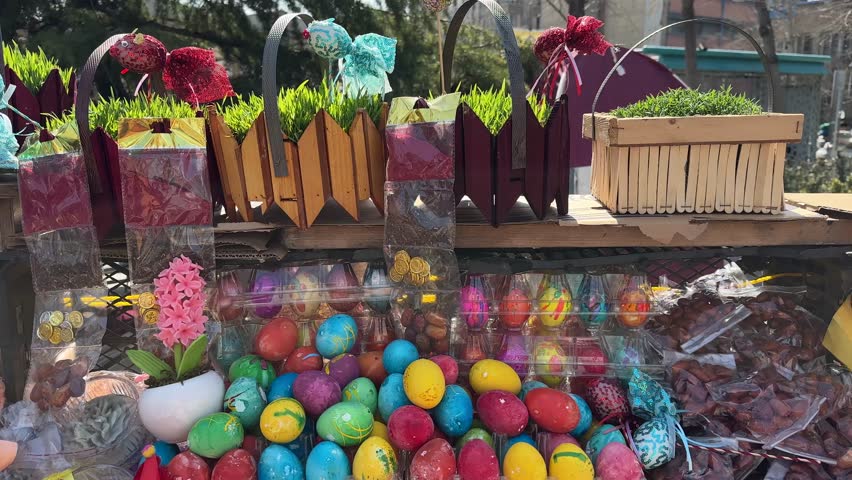 Colorful Easter eggs for ritual Nowruz celebration in Tajrish Bazaar Iran traditional market decoration spring holiday sunny nature urban landscape Persian design festive decoration seasonal outdoors